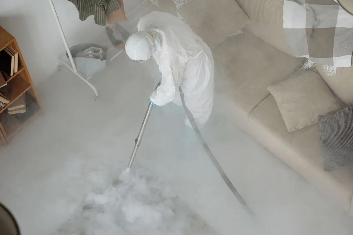 Biohazard cleanup technician in protective equipment, Owenton, KY